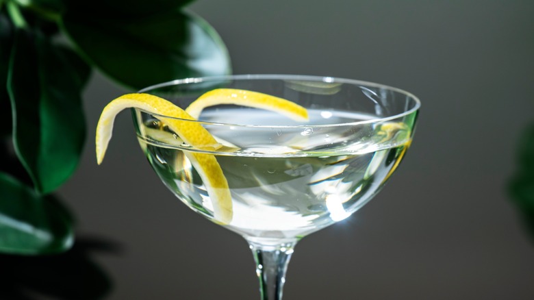 Close-up of martini with thin lemon twist garnish