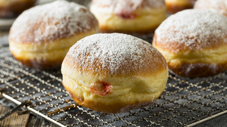 Polish donuts cooling on a rack.