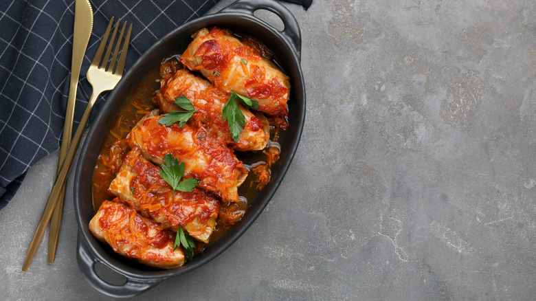 Cabbage rolls covered in tomato sauce