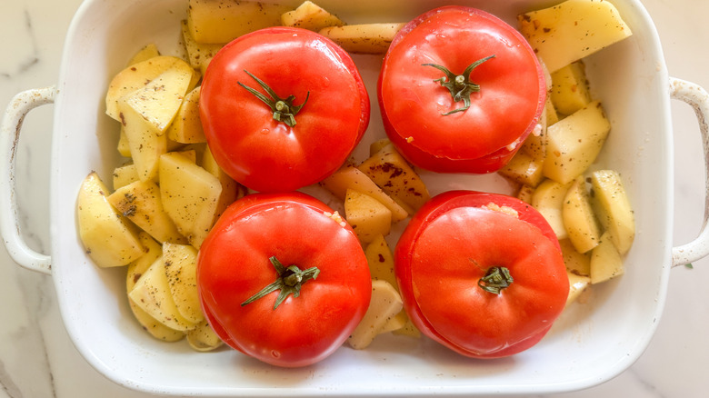 tomatoes and potatoes in baking dish