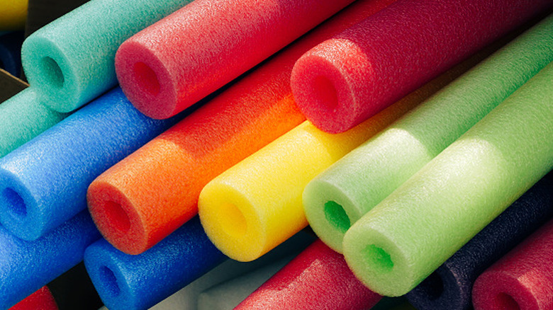stack of colorful pool noodles