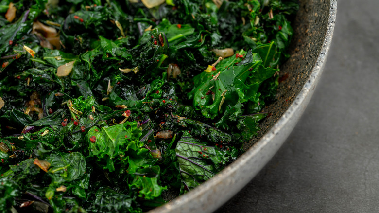 Close up of sauteed greens in bowl.