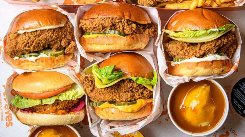 Popeyes chicken sandwiches sit together on a tray