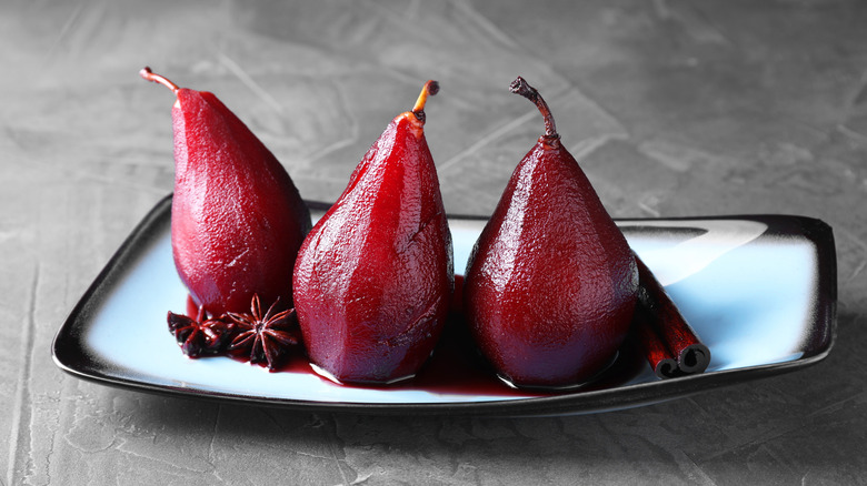 A plate of red-wine-poached pears, known as Peeres in Confyt in medieval times