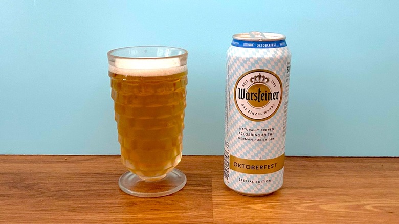 Glass and can of Warsteiner Premium Oktoberfest beer