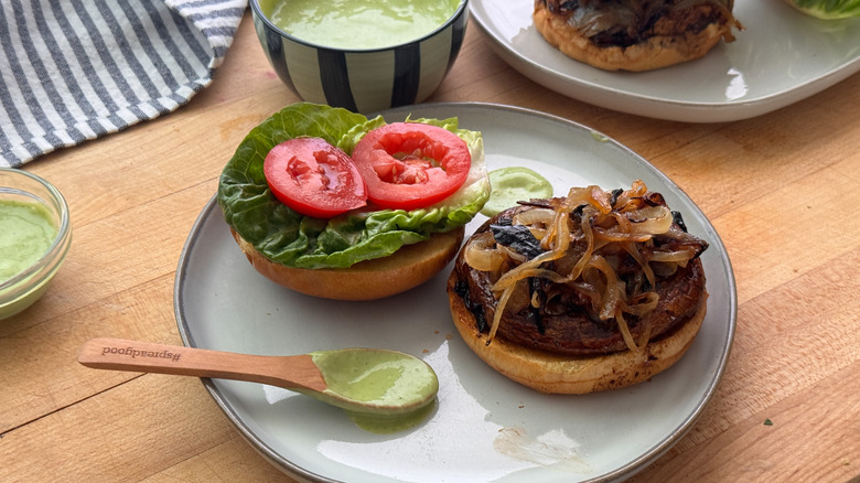 Open faced portobello mushroom burger on plate