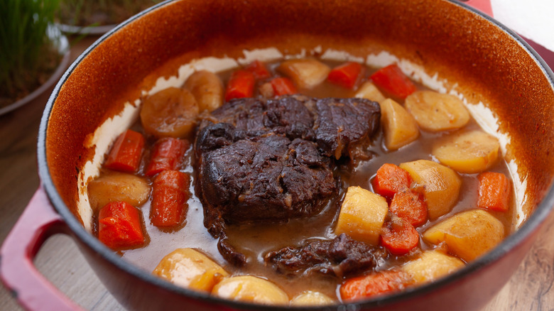 A small serving of pot roast in sauce.