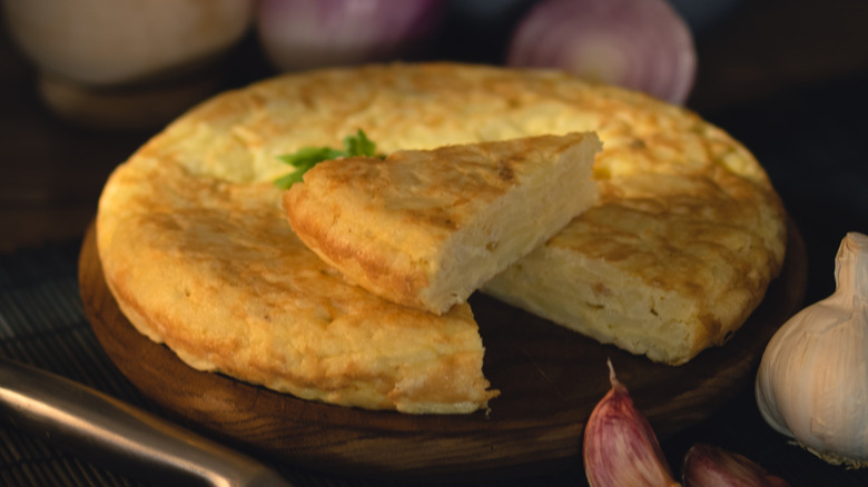 A spanish tortilla on dark background