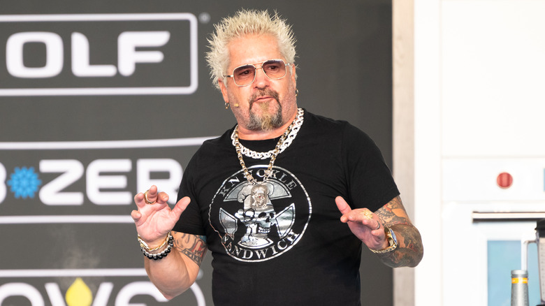 Close up of Guy Fieri at cooking demonstration