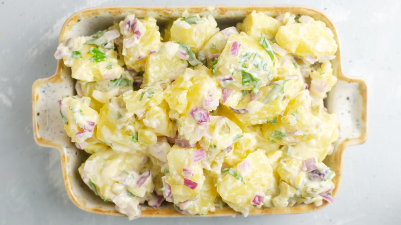 creamy potato salad in a casserole dish