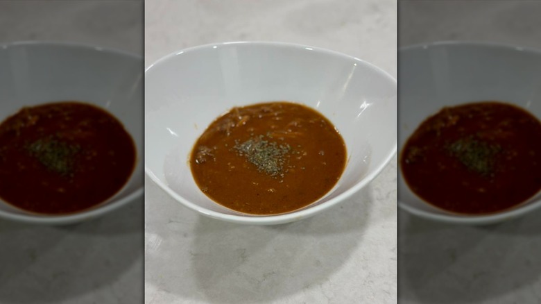 Turtle soup in large white bowl