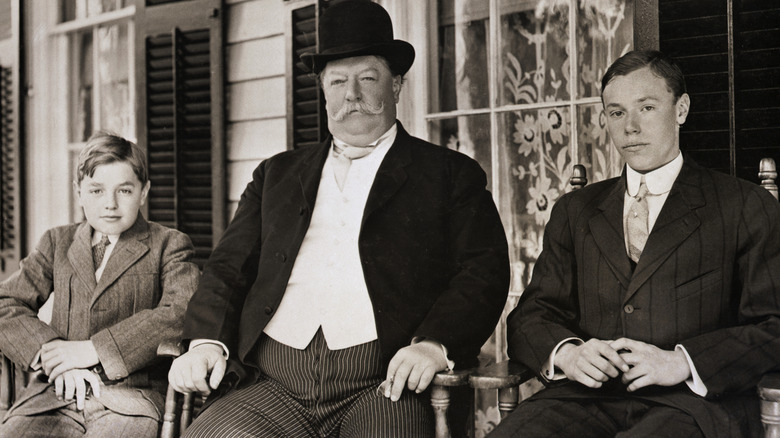 Black and white of President William Howard Taft with two of his sons