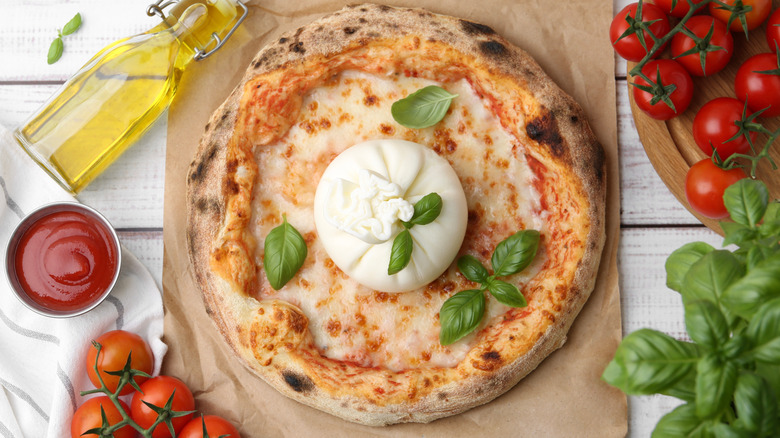 A delicious homemade pizza with burrata cheese.