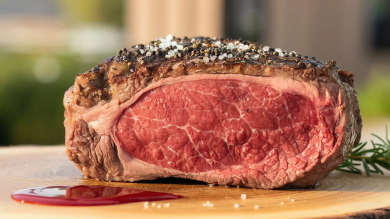 A big slab of prime rib topped with seasoning