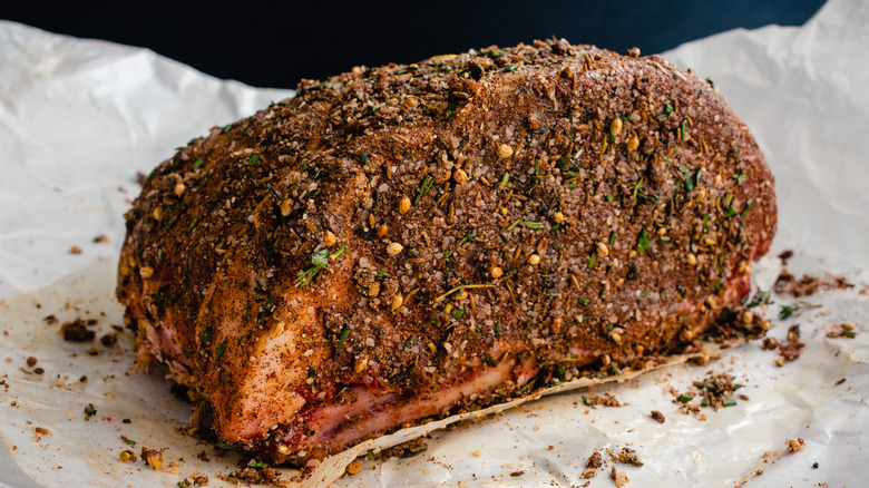 Raw seasoned prime rib.