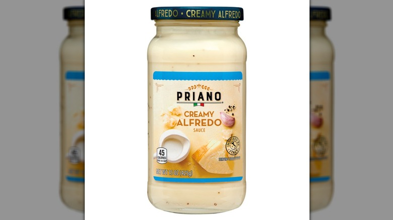 A jar of Aldi's Priano Creamy Alfredo Sauce