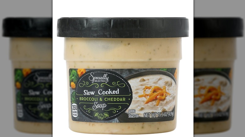 A container of Specially Selected Slow Cooked Broccoli and Cheddar Soup