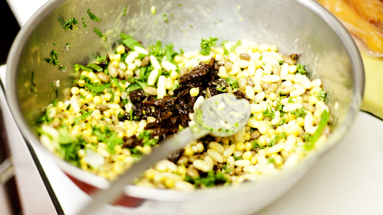 bean salad being made in a mixing bowl