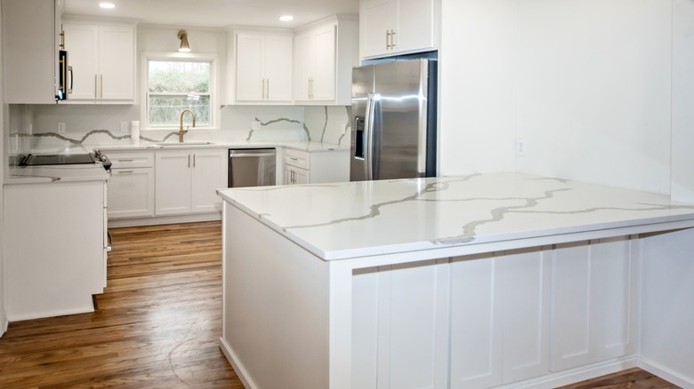 modern kitchen with white quartz countertops