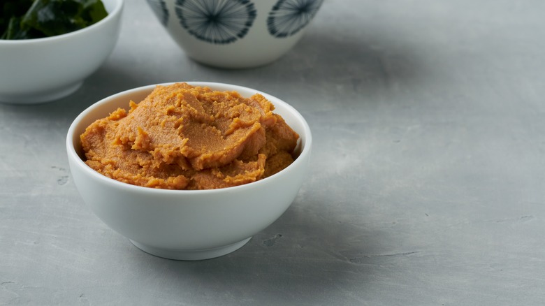 A white bowl filled with miso paste