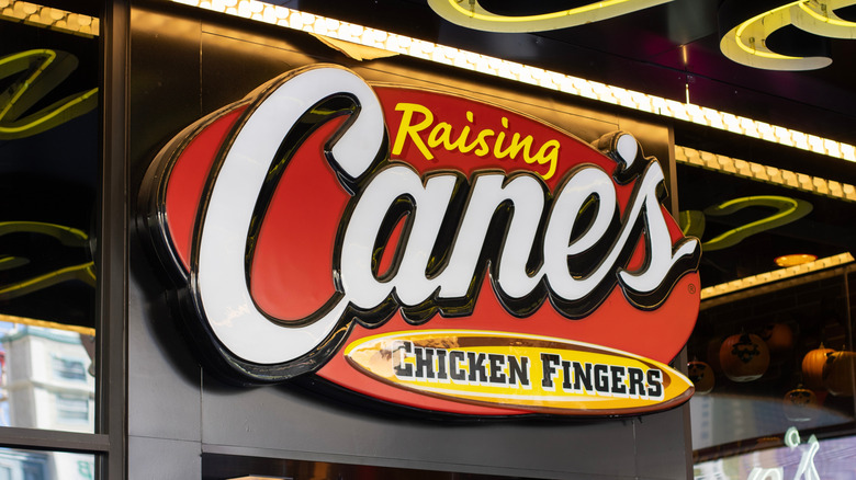 A Raising Cane's storefront sign