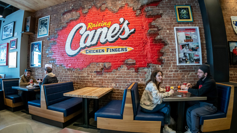 Raising Cane's interior shot of customers enjoying their meals