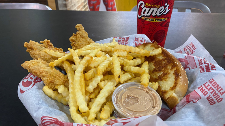 A three piece chicken tender order from Raising Cane's with Texas Toast, fries, and a drink