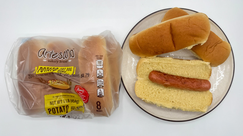 Hot dog with buns on a plate with packaging