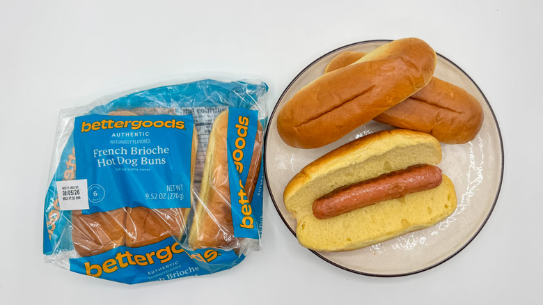 Hot dog with buns on a plate with packaging