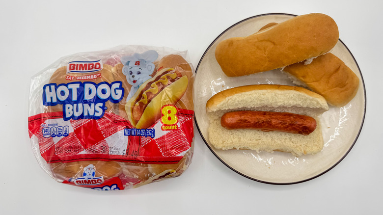 Hot dog with buns on a plate with packaging