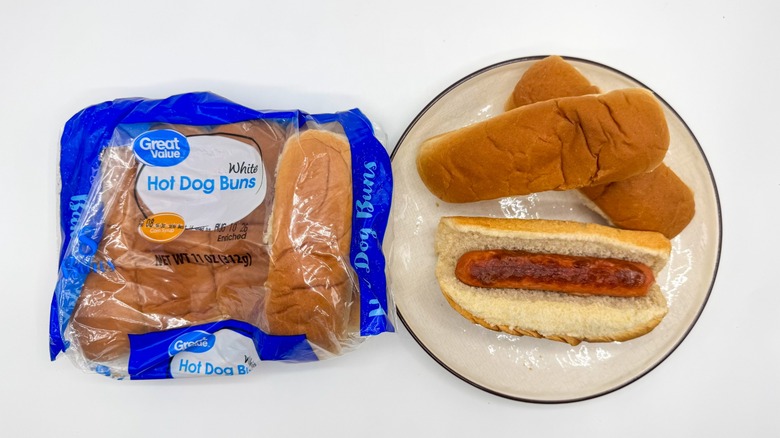 Hot dog with buns on a plate with packaging