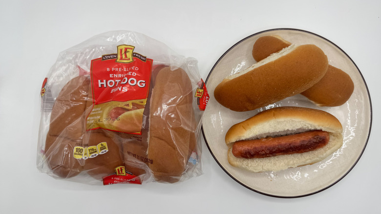 Hot dog with buns on a plate with packaging