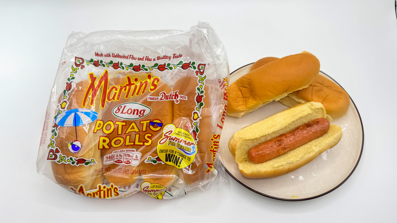 Hot dog with buns on a plate with packaging