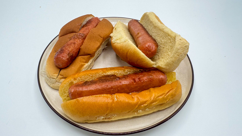 Hot dog with buns on a plate with packaging