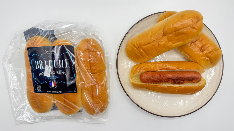 Hot dog with buns on a plate with packaging