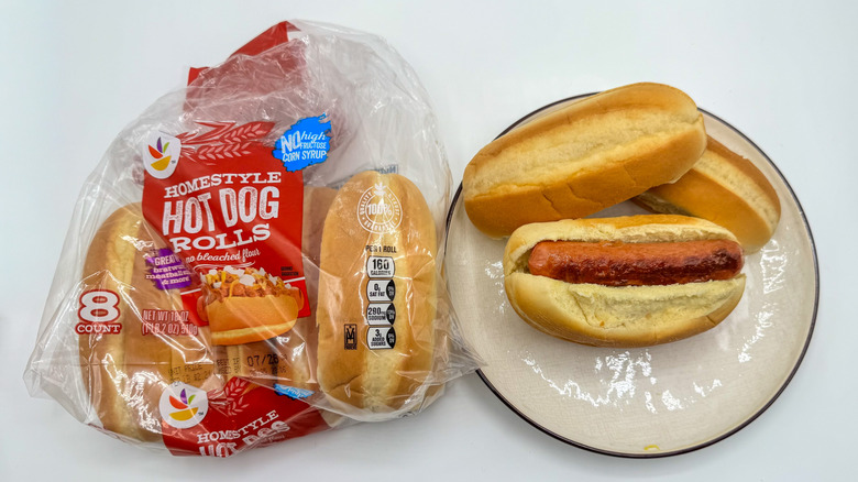 Hot dog with buns on a plate with packaging