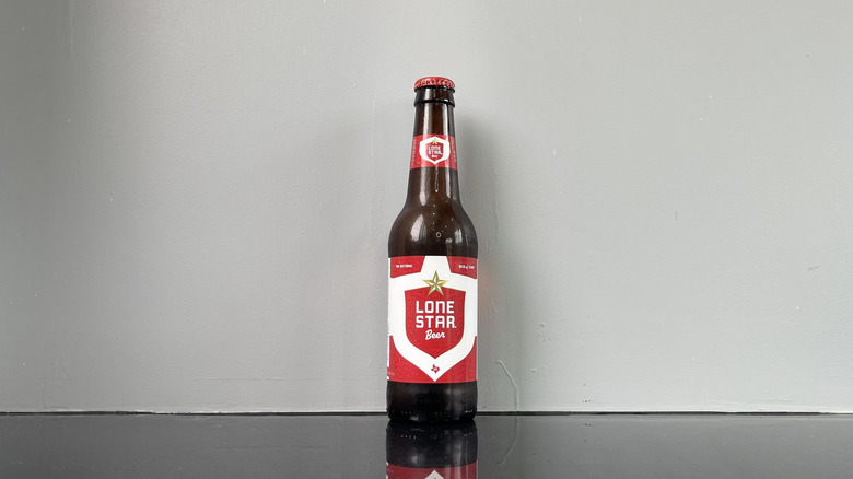 A bottle of Lone Star on dark table