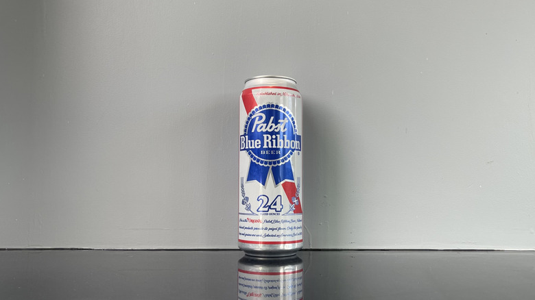 A tall boy of PBR on dark table