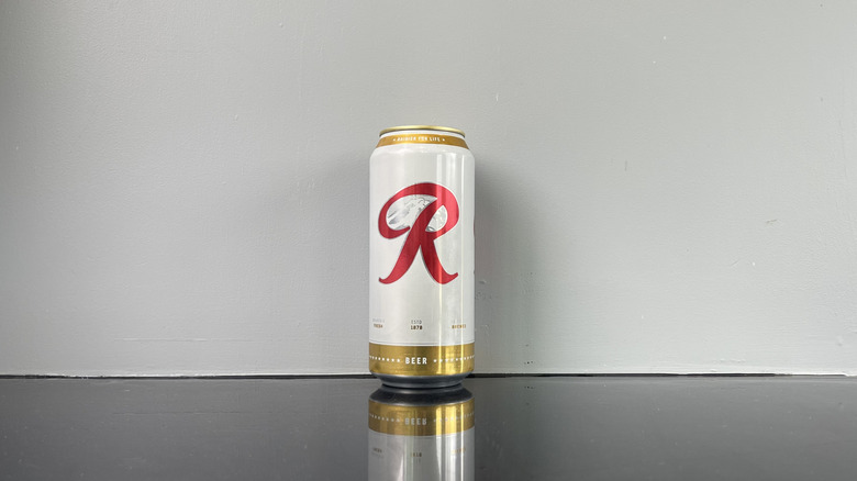 A can of Rainier on dark table
