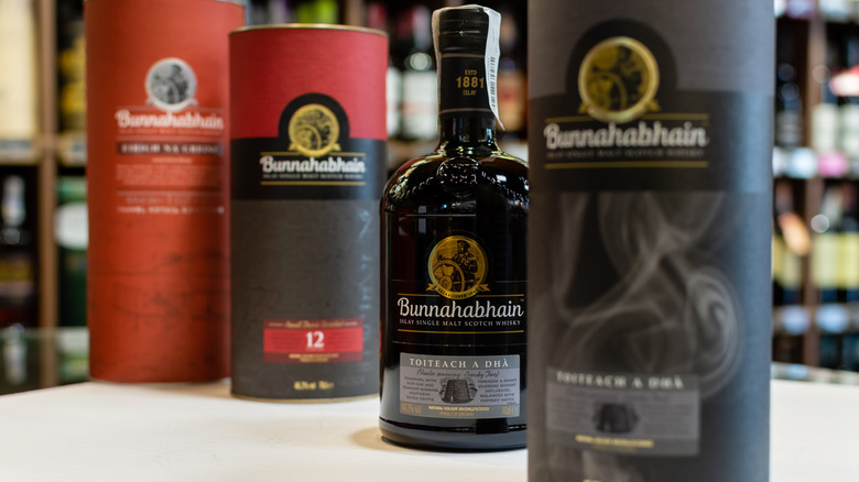 Various Bunnahabhain whisky bottles on a table.