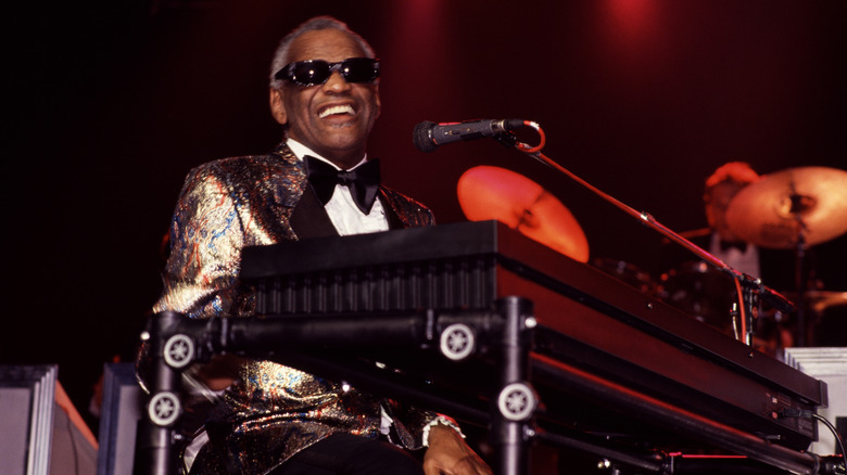 singer Ray Charles at a piano with microphone