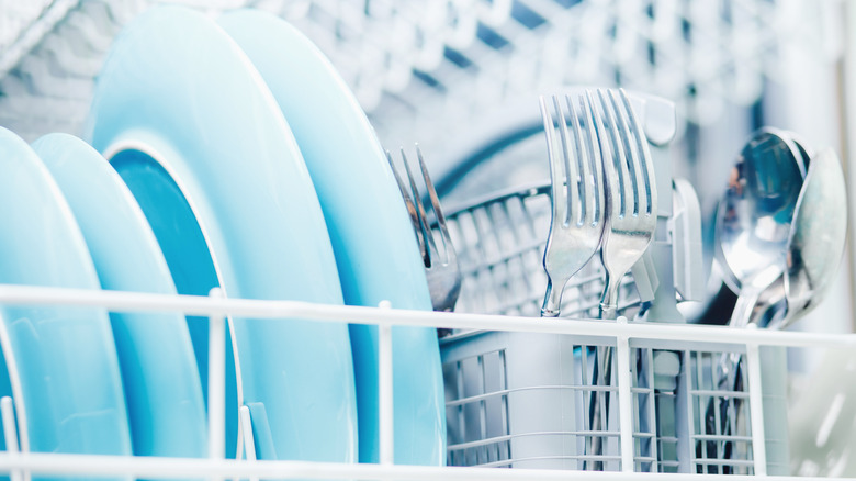 Clean dishes in dishwasher