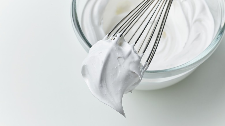 whipped egg white on whisk