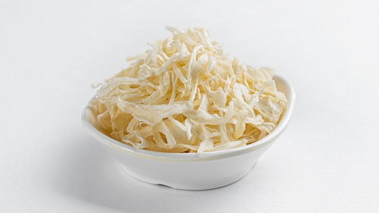 Dehydrated onion flakes in a bowl