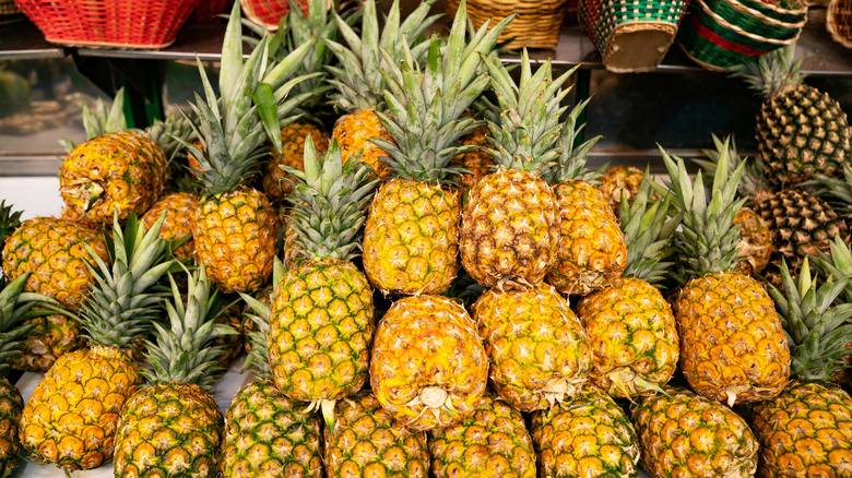 Pile of pineapples in store