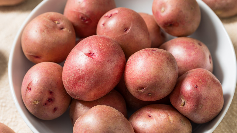 Small red potatoes in a white bowl