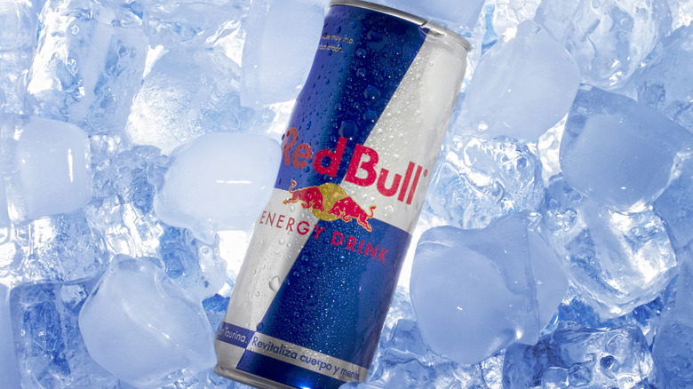 Can of Red Bull energy drink in ice