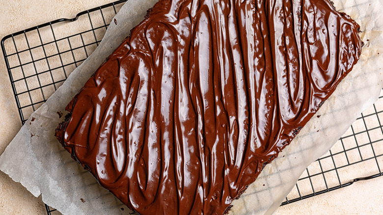 Chocolate sheet cake on a cooling rack