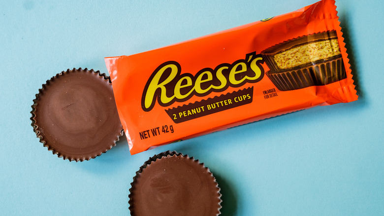 Pack Of Reeses Peanut Butter Cup Chocolate cups on blue background