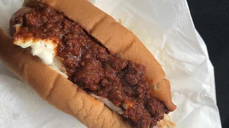 A hot dog topped with Carolina style chili
